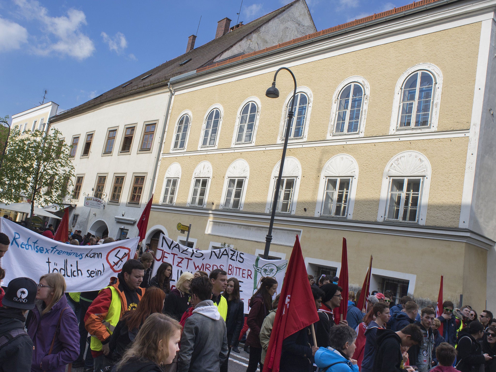 Protesters gather outside the house where Adolf Hitler was born during an anti-Nazi protest in Braunau Am Inn, Austria on April 18, 2015.