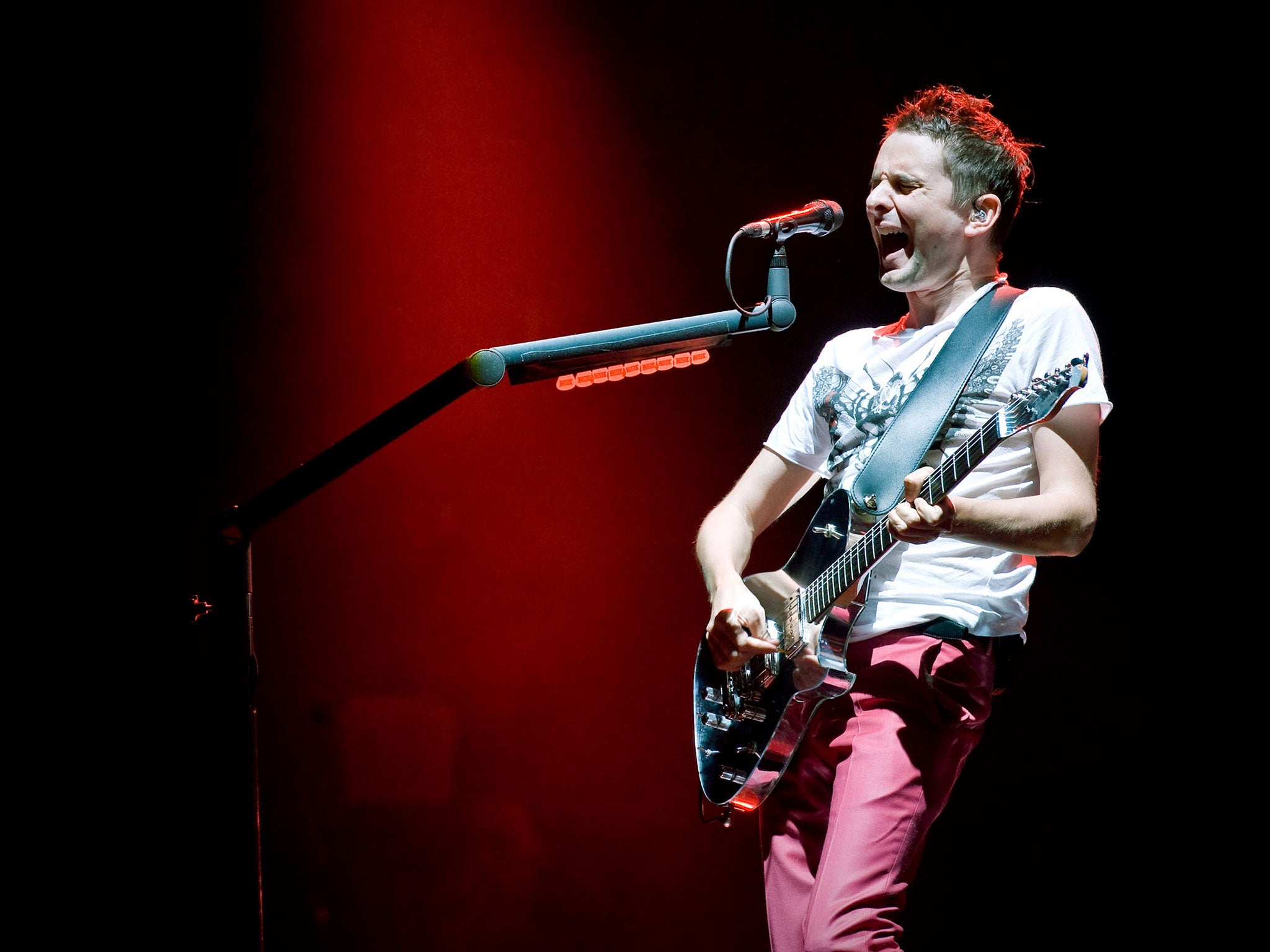 Matt Bellamy of 'Muse' on The Pyramid Stage in 2010. The band will be the first to headline the main stage all three nights of the festival