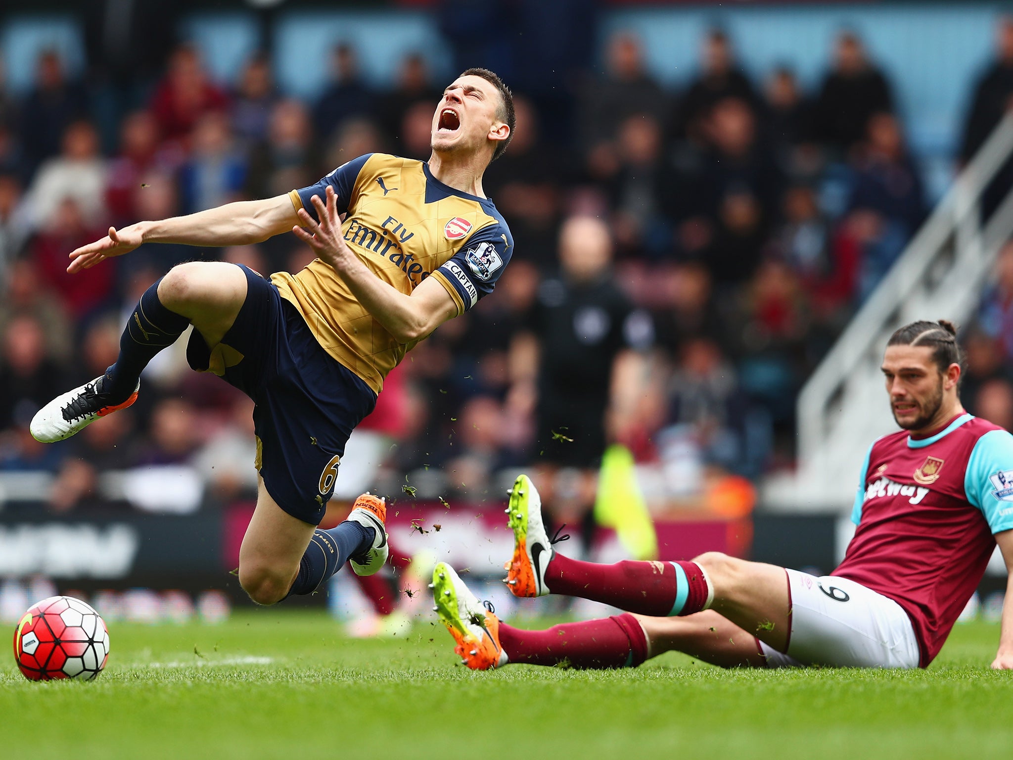 Laurent Koscielny is felled by Carroll early on