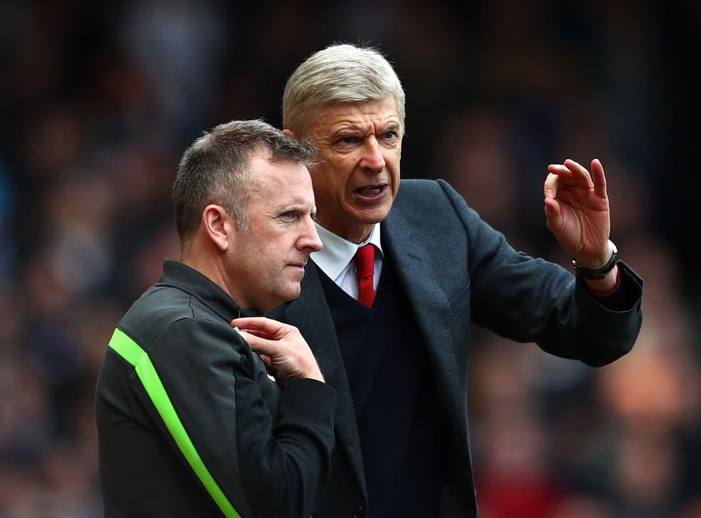 Wenger remonstrates with fourth official Jon Moss
