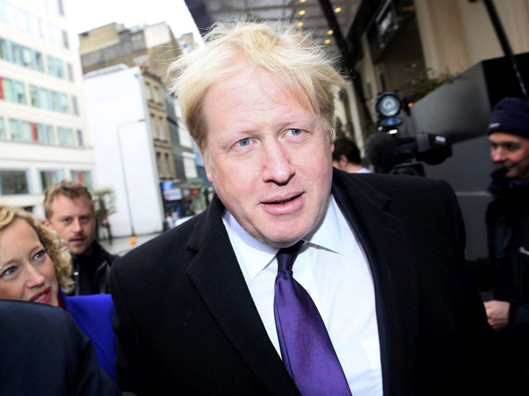 Boris Johnson was questioned by Channel 4 News' Cathy Newman, left, as he made his way to the Conservative Spring Forum