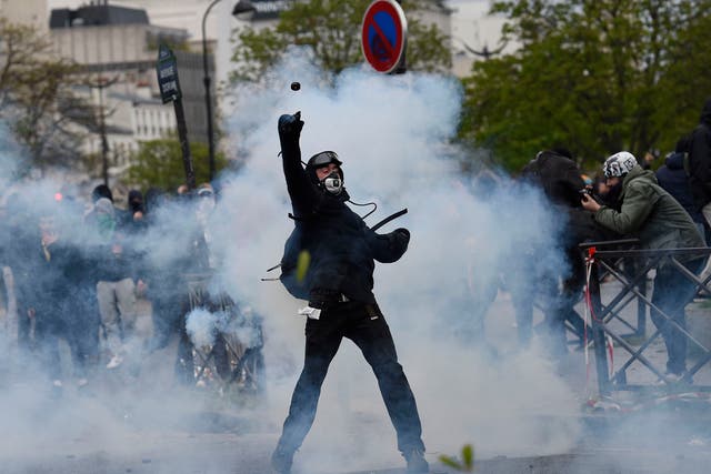 Protesters in Paris threw bottles, sticks and firecrackers at police