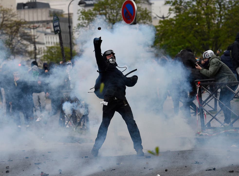 Protesters in Paris threw bottles, sticks and firecrackers at police