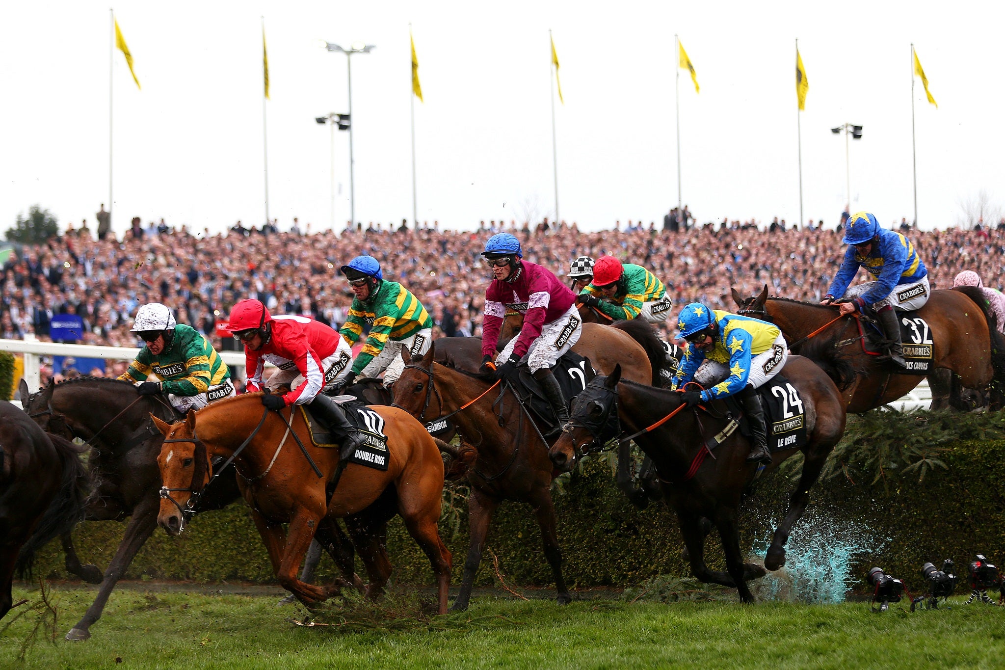 Rule The World runs in the pack on his way to Grand National victory