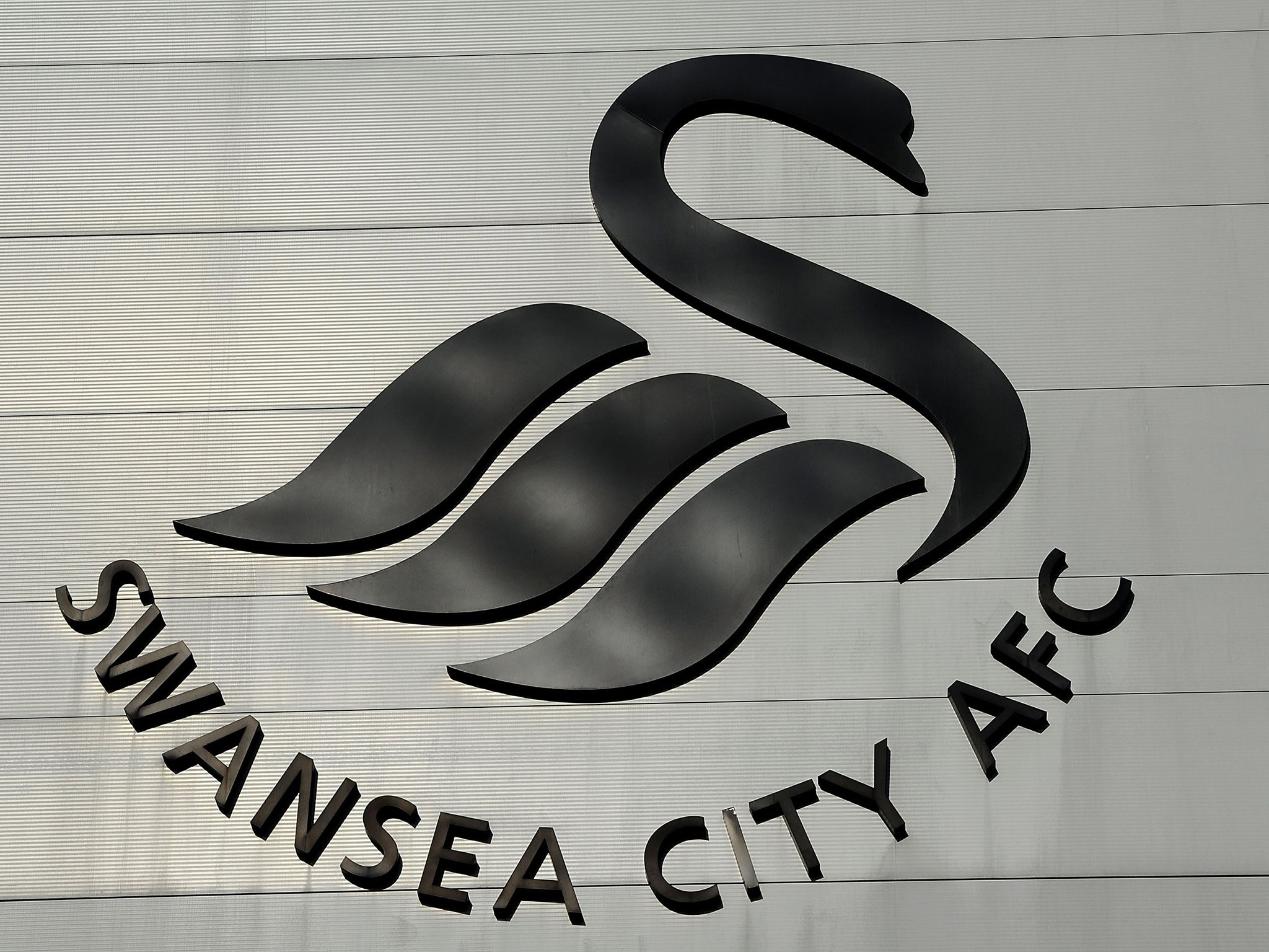 Swansea City's logo outside the Liberty Stadium