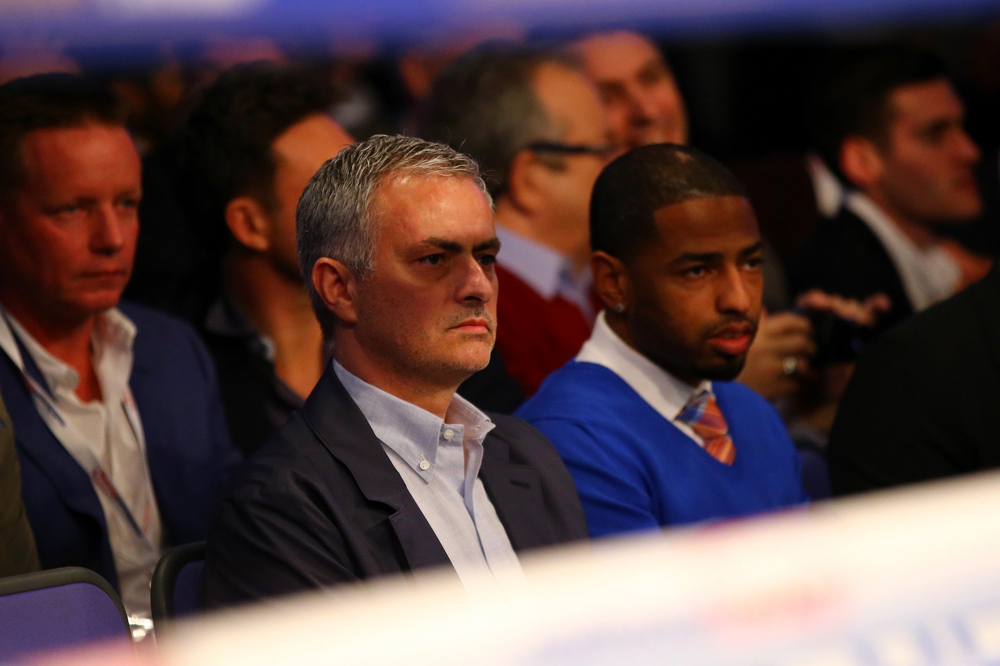 Former Chelsea manager Jose Mourinho watches on at ringside