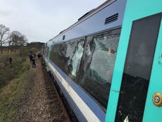 Norfolk train crashes with tractor: Drivers 'seriously injured' as 10 hurt in level-crossing collision
