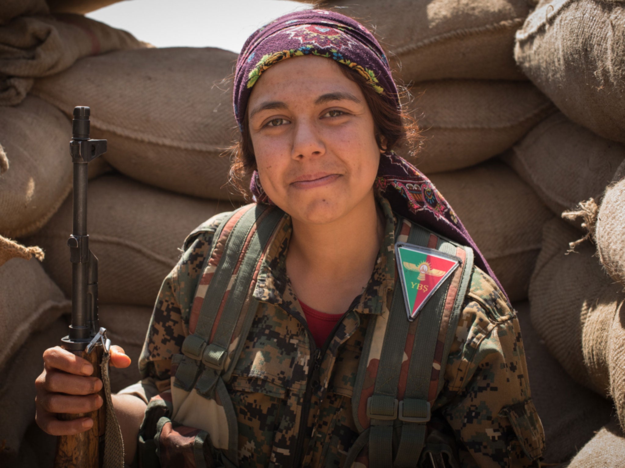 "We never played princesses as little girls," a 30-year-old YPG fighter jokes