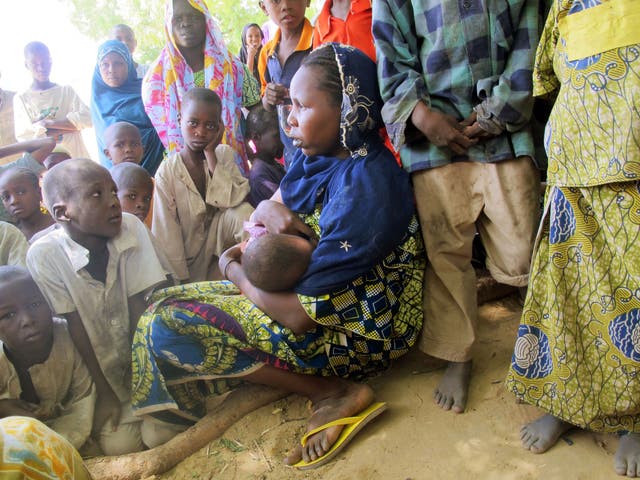 A woman breast-feeding in Cameroon, where up to 50% of girls as young as ten are thought to suffer breast ironing