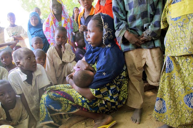 A woman breast-feeding in Cameroon, where up to 50% of girls as young as ten are thought to suffer breast ironing