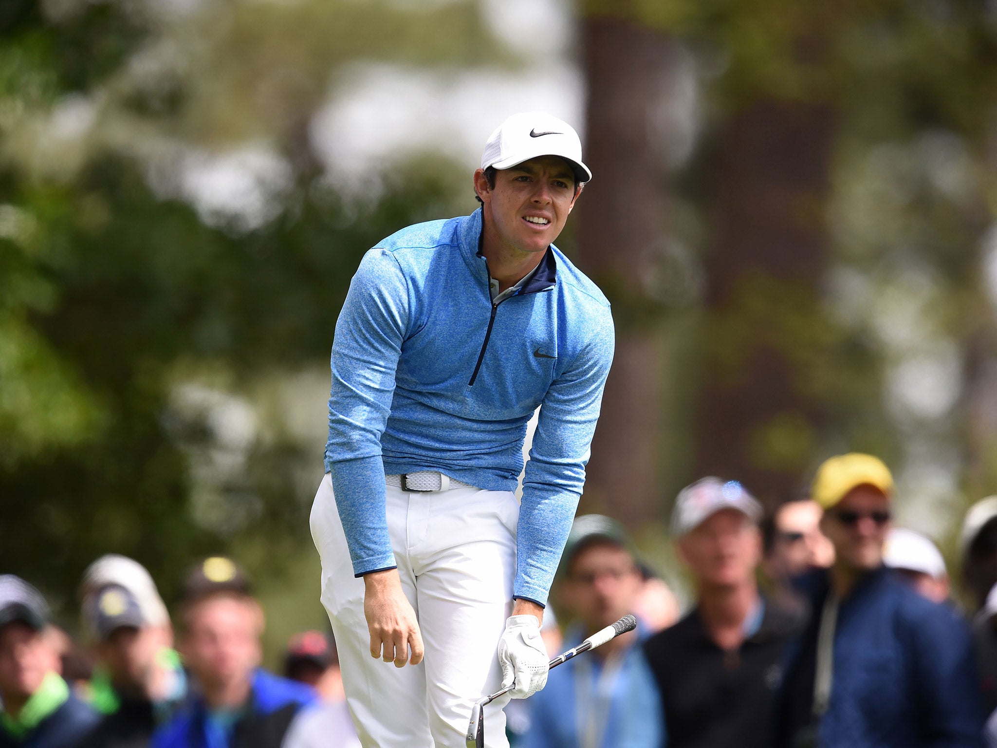 Rory McIlroy reacts after teeing off on the fourth hole on the final day of The Masters