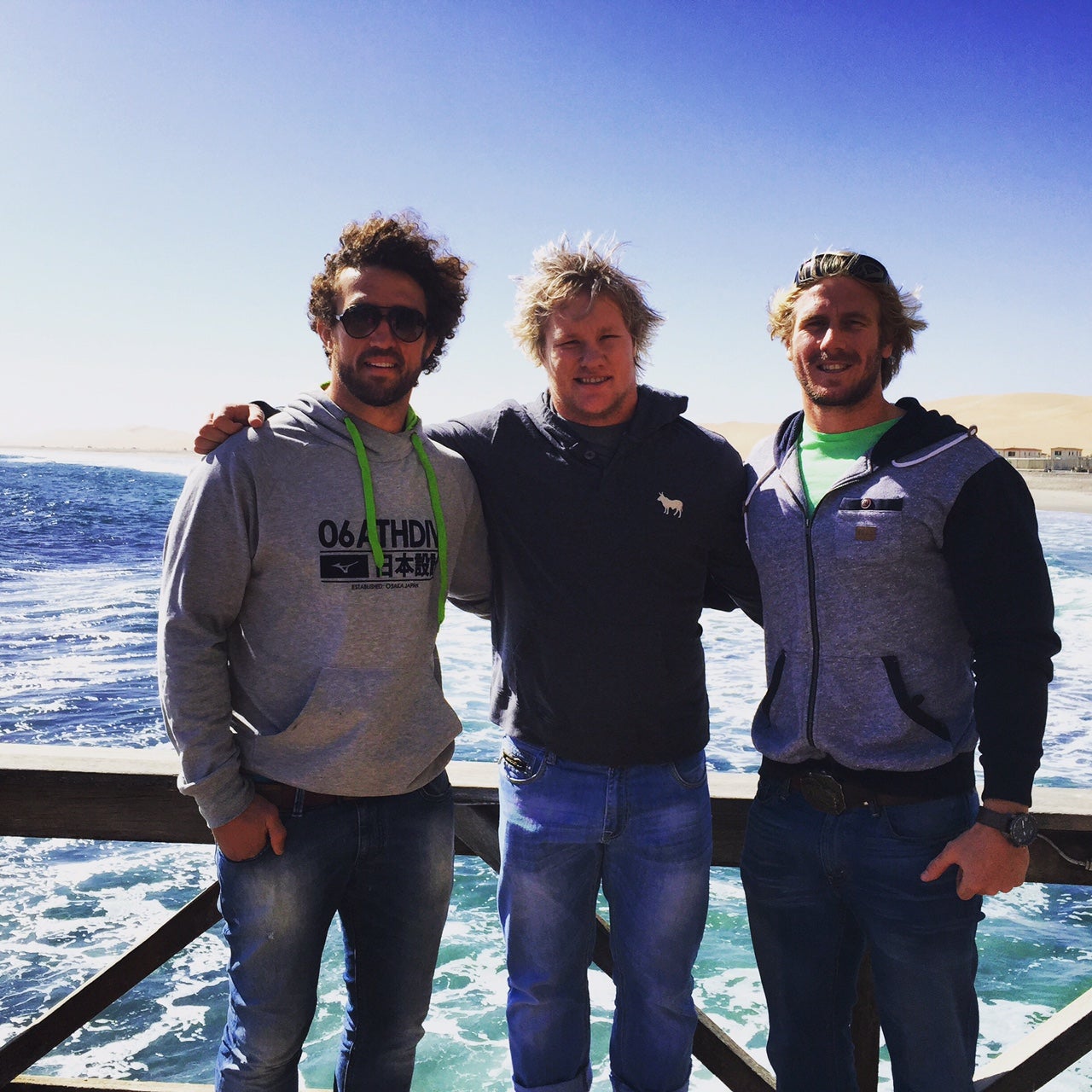 Burger, left, with teammates on a boat-ride in Namibia