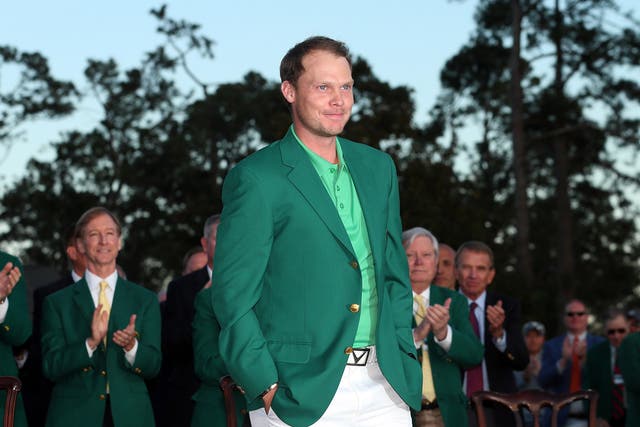 Danny Willet receives his green jacket after winning the 2016 Masters