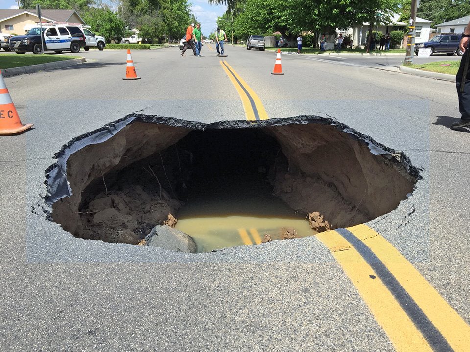 Video Shows Huge Sinkhole Open Up On Street In California