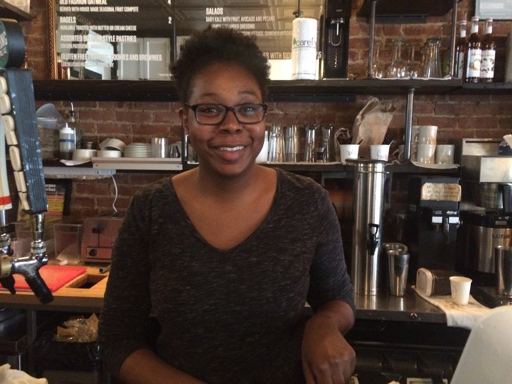 Angela Elem working behind the bar of Lenox Coffee in Harlem Feliks Garcia
