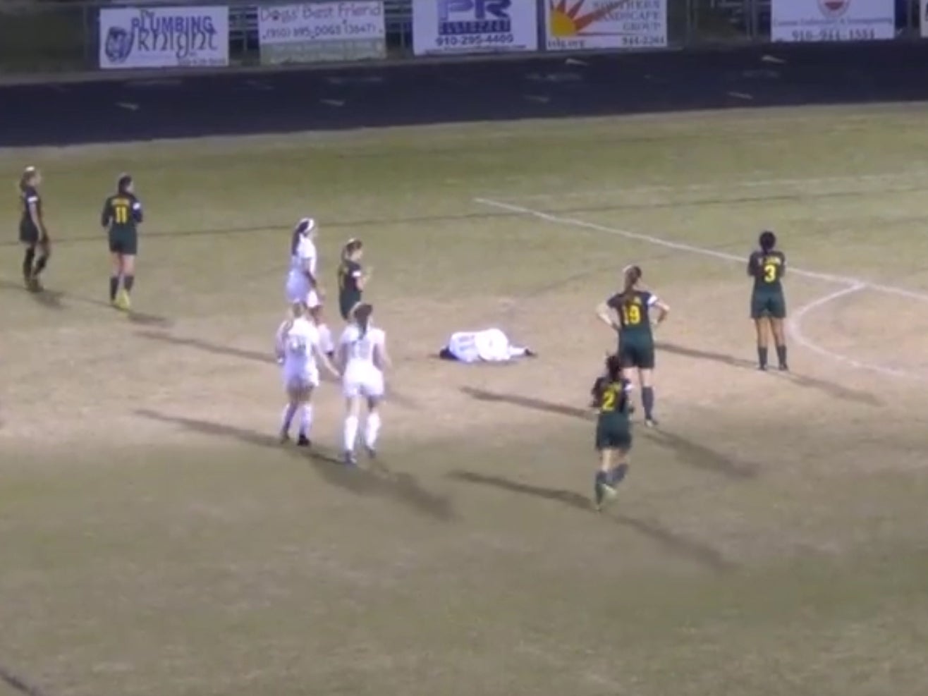 Goalkeeper slams opponent into ground with massive spear tackle during girls' football match at high school