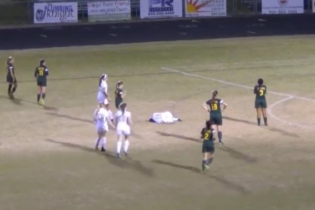 Goalkeeper slams opponent into ground with massive spear tackle during girls' football match at high school