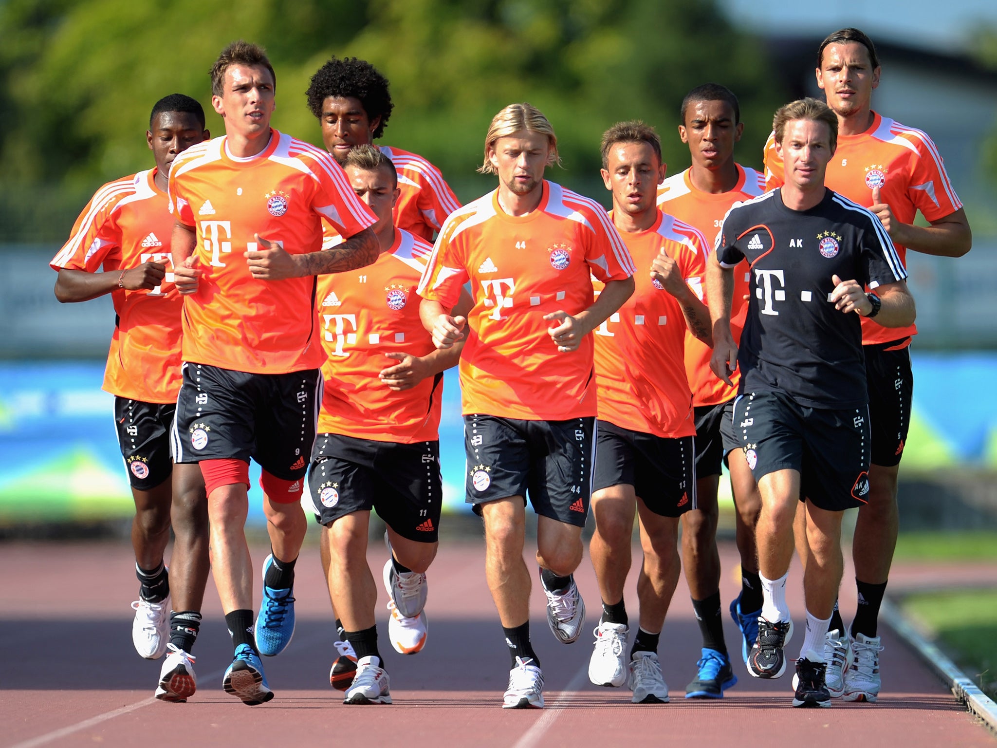 Kornmayer, in black, leading a fitness drill during the 2012/13 pre-season