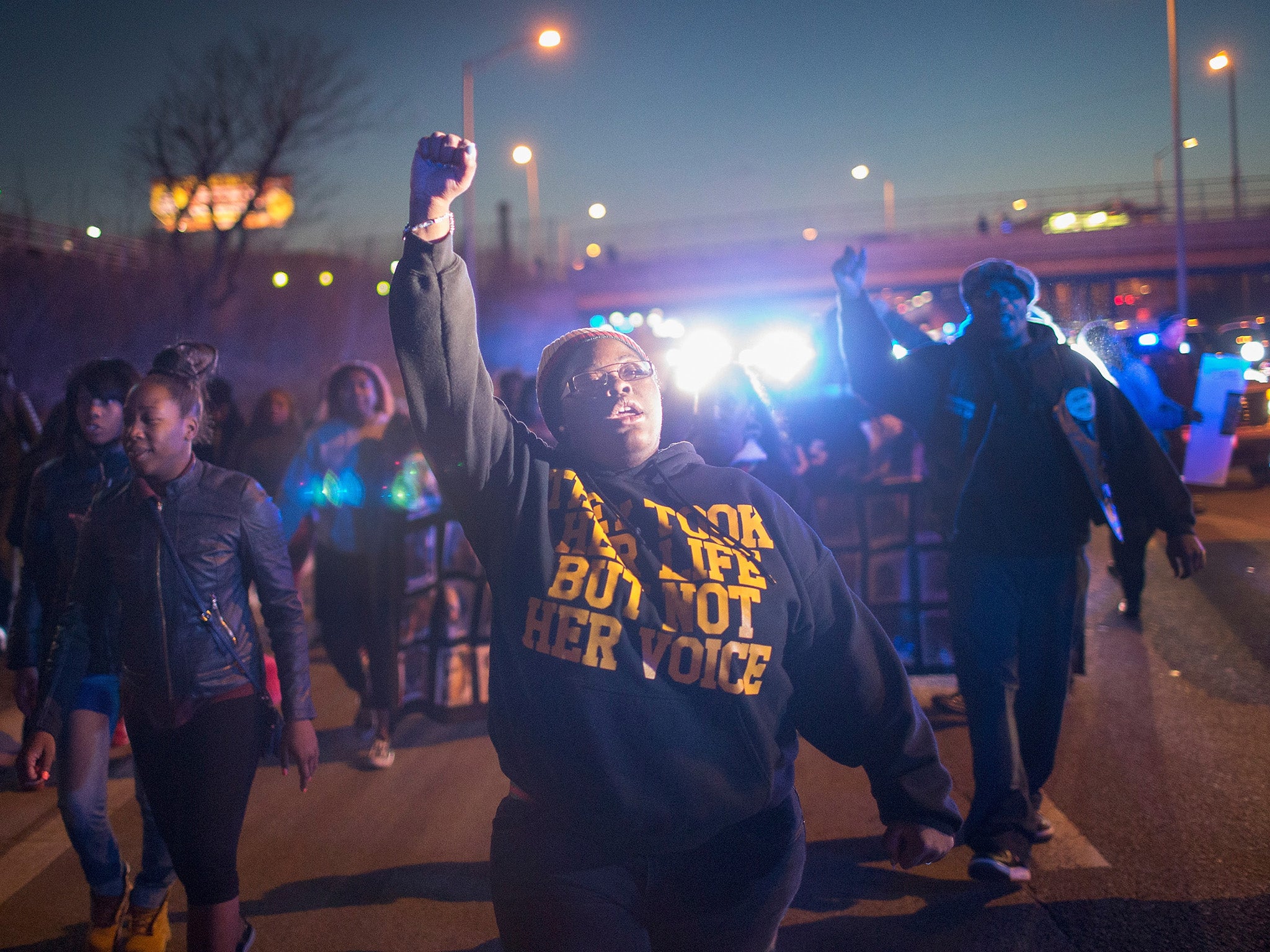 Demonstrators protesting the shooting death of 16-year-old Pierre Loury block traffic on the Eisenhower Expressway during a march