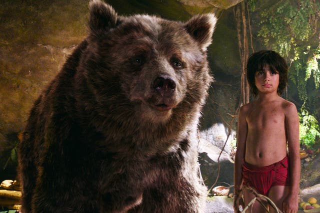 Mowgli (Neel Sethi) and Baloo the bear, voiced by Bill Murray