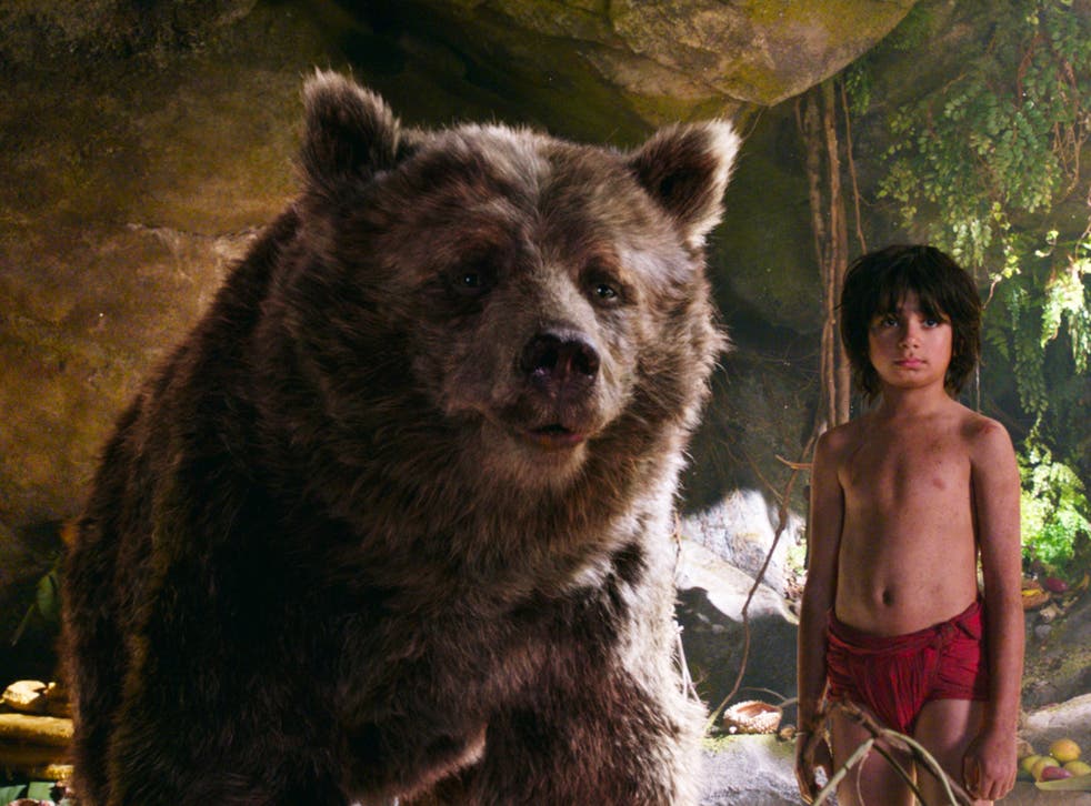 Mowgli (Neel Sethi) and Baloo the bear, voiced by Bill Murray