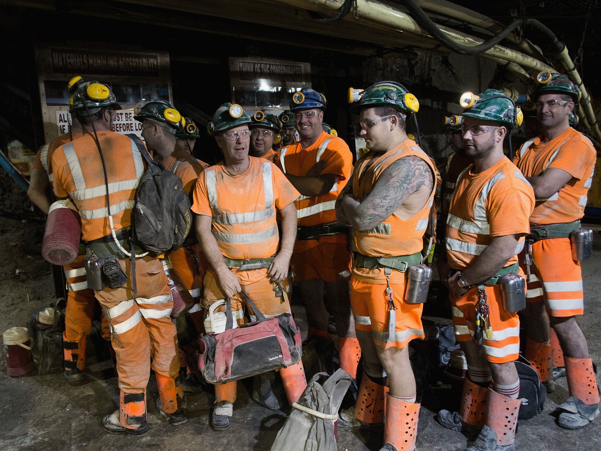 Miners wait for the cage that will transport them back to the surface at the Boulby Potash mine