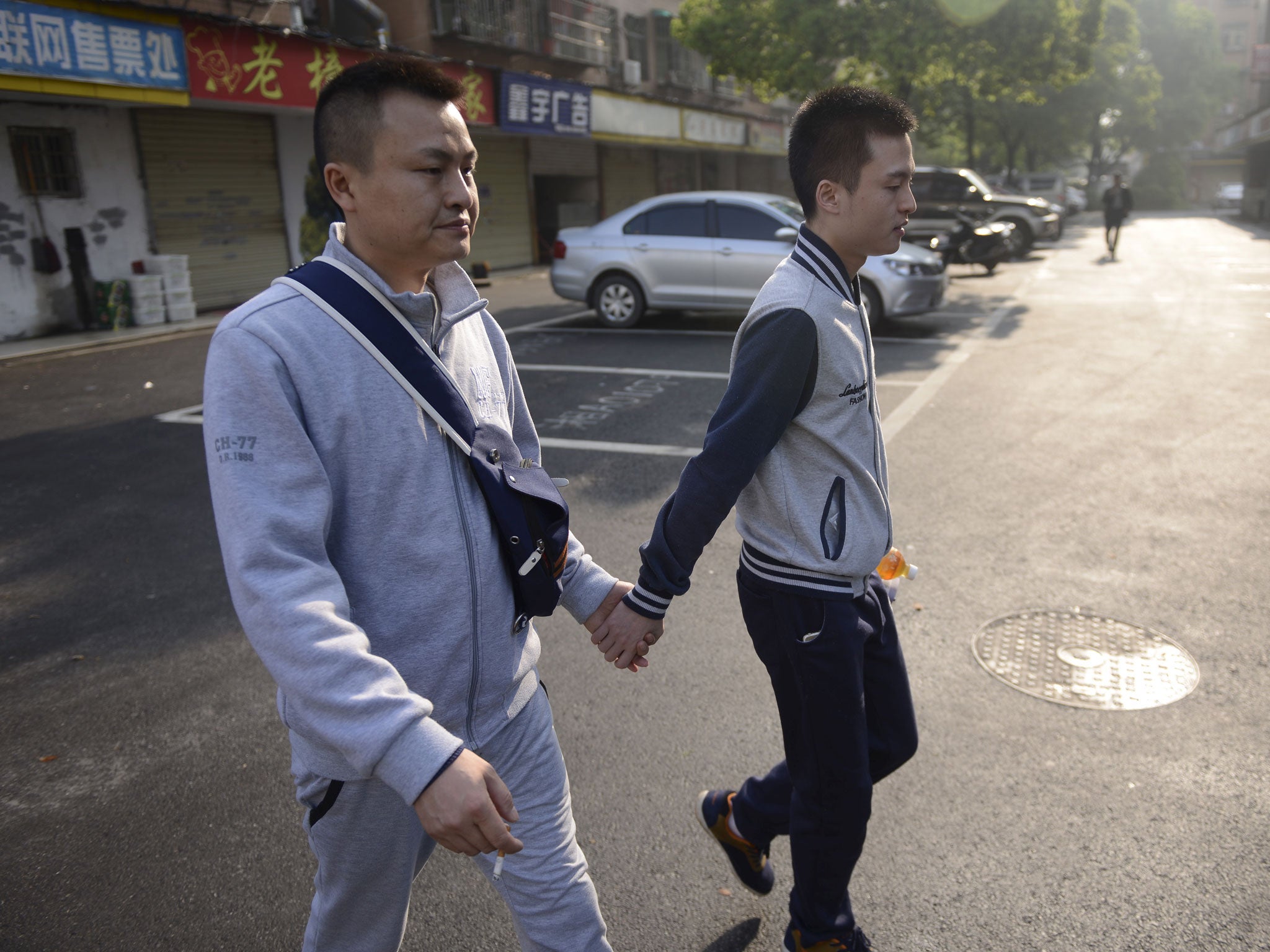 Sun Wenlin and his partner Hu Mingliang make their way to court