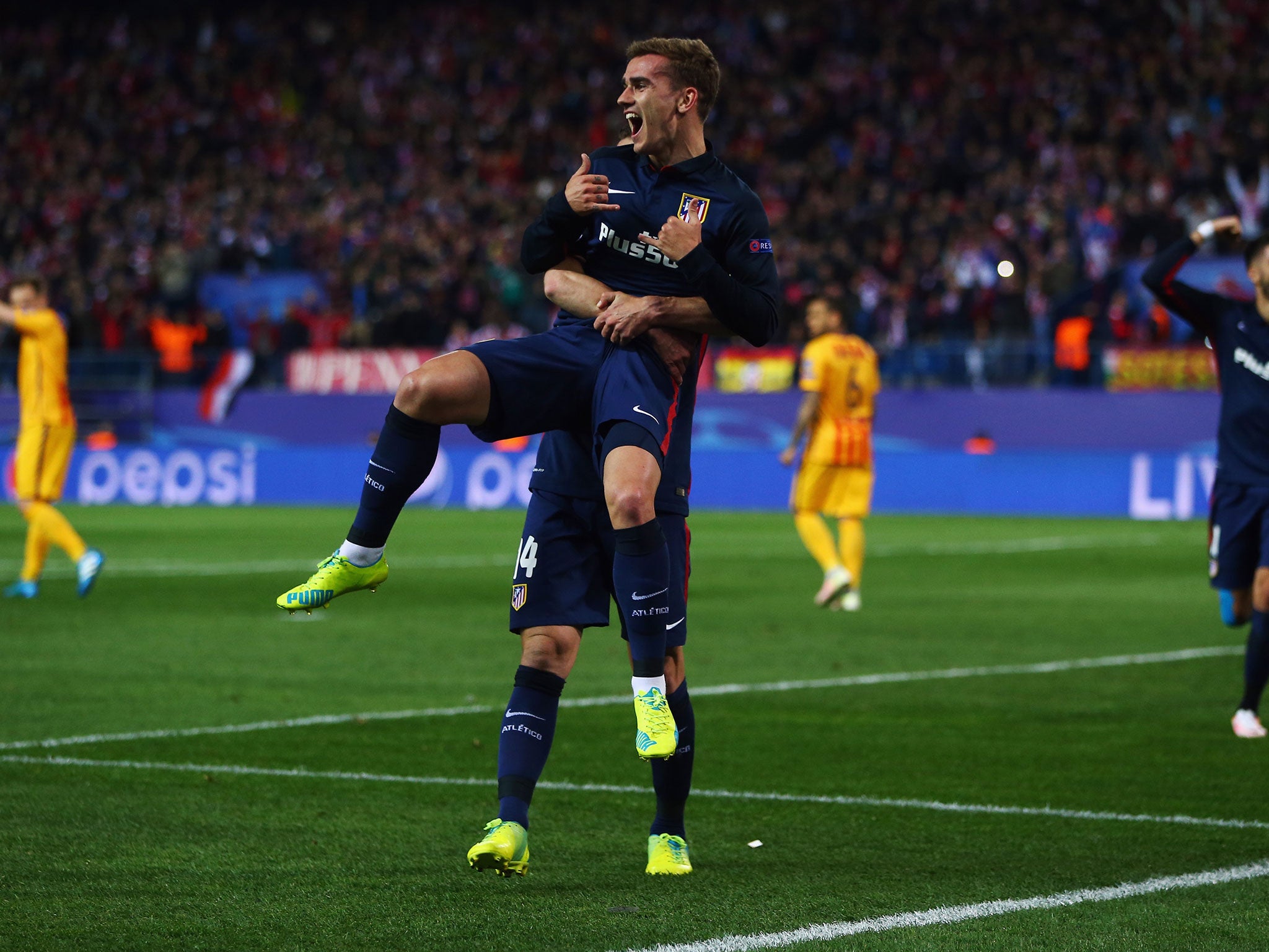 Antoine Griezmann celebrates scoring for Atletico Madrid against Barcelona