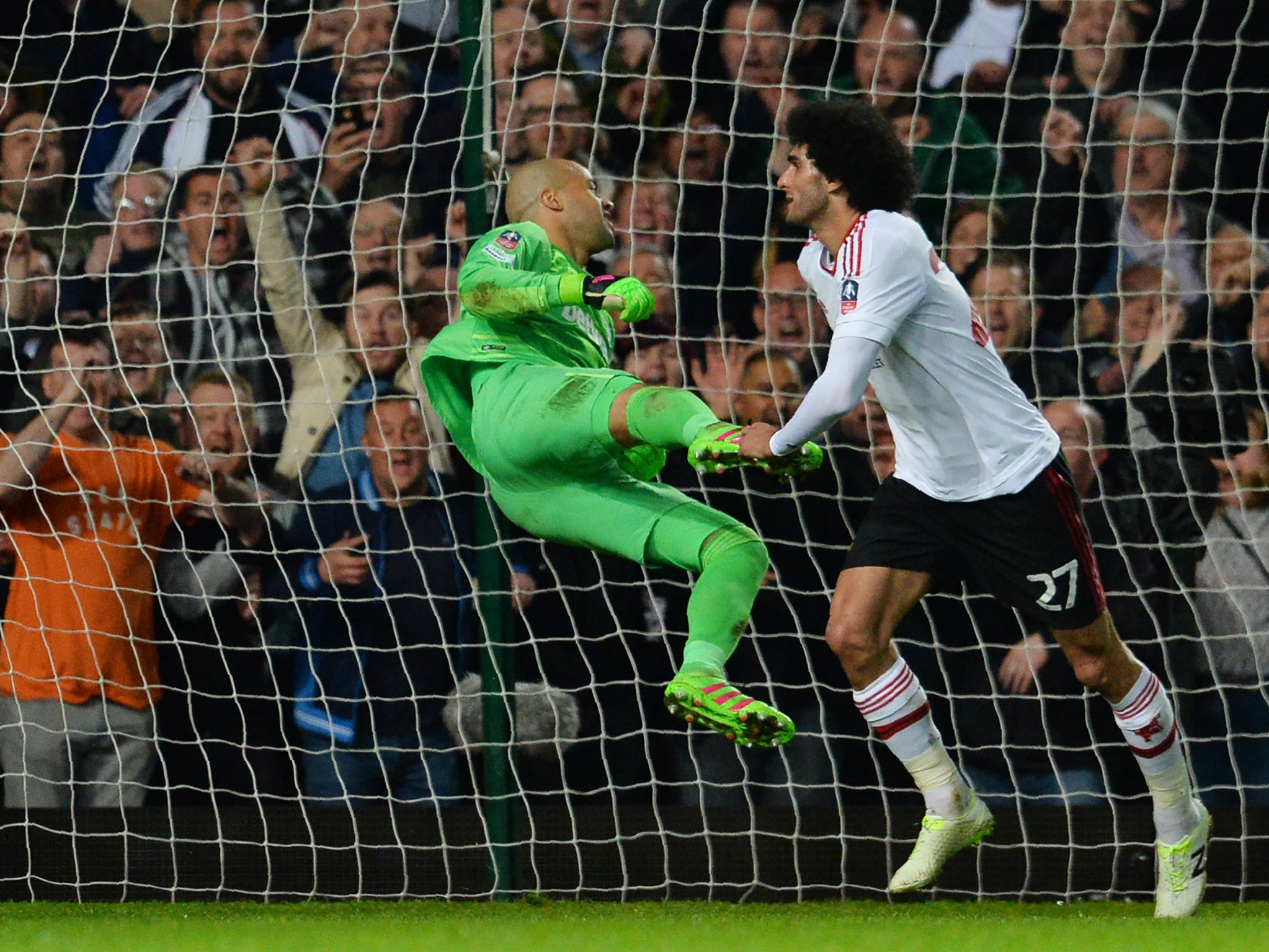 Fellaini starts to celebrate after scoring his goal