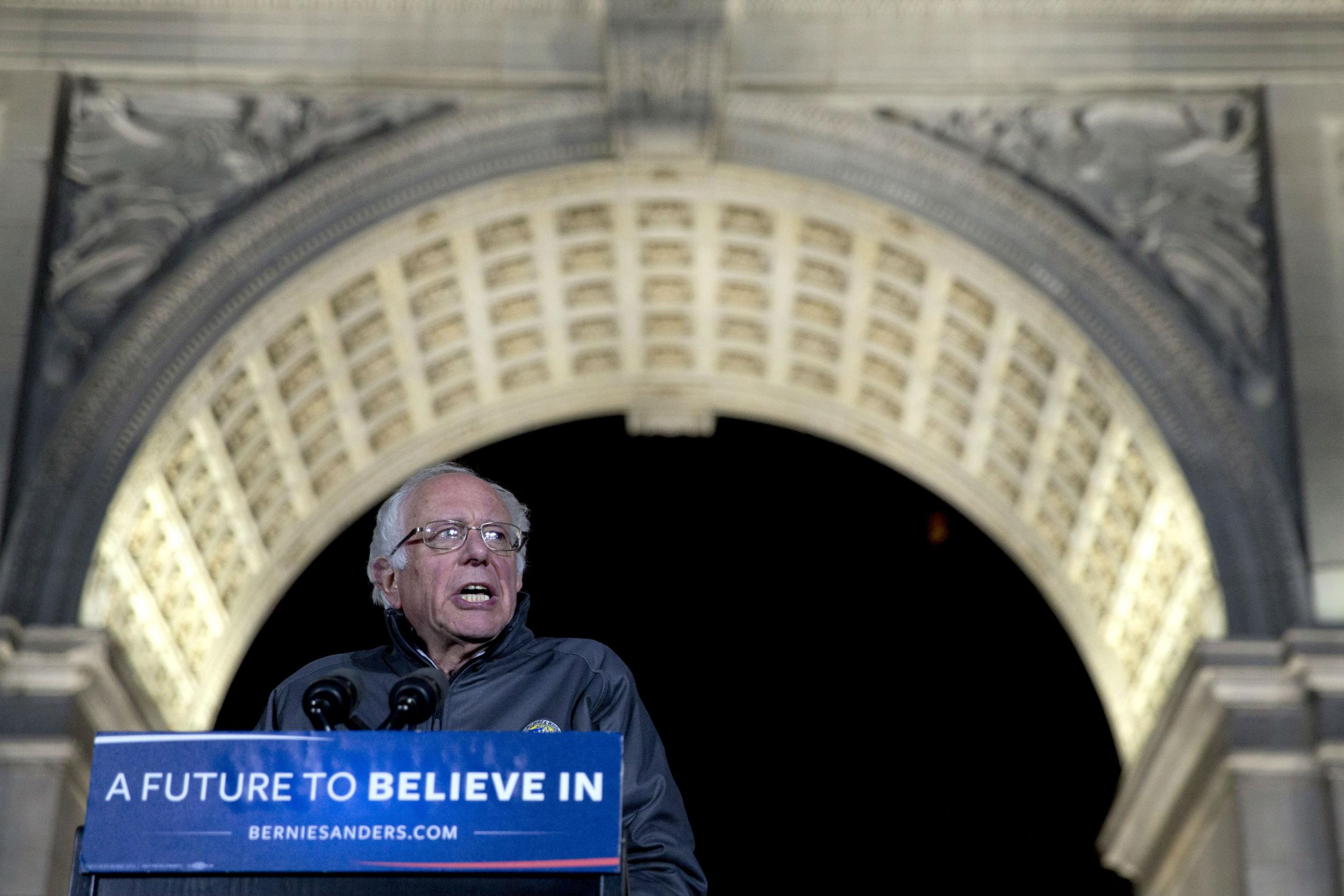 Sanders stood under the symbolic Washington Square arch and the words 'Let us raise a standard to which the wise and the honest can repair'