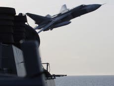 Russian jets buzz US Navy destroyer in 'simulated attack'