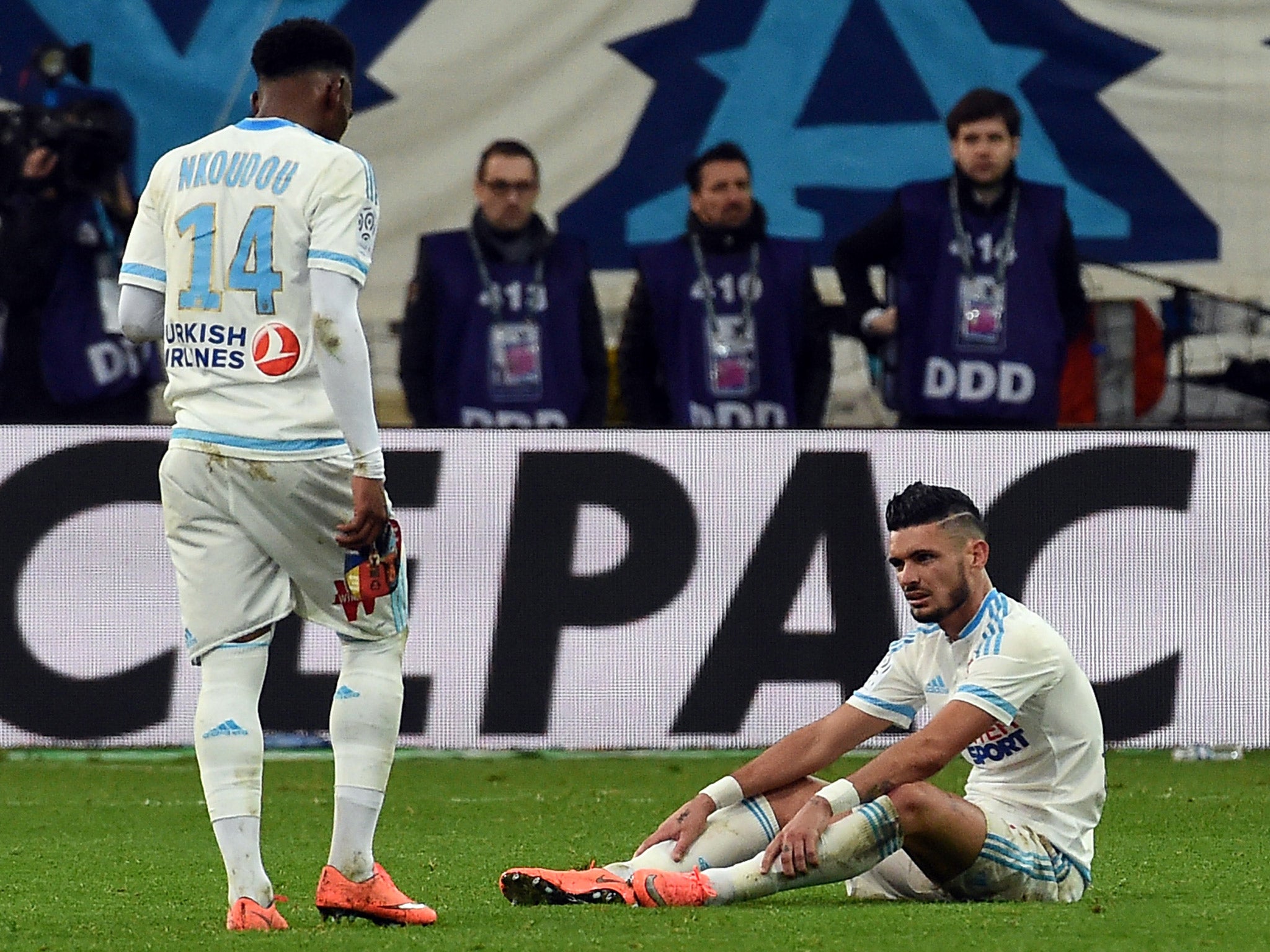 Georges-Kevin Nkoudou and Remy Cabella look dejected after Marseille's loss to PSG