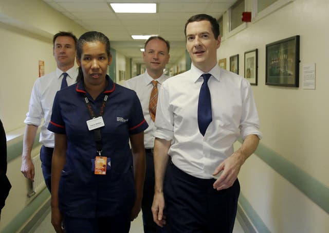 George Osborne on a visit to a hospital with Jeremy Hunt
