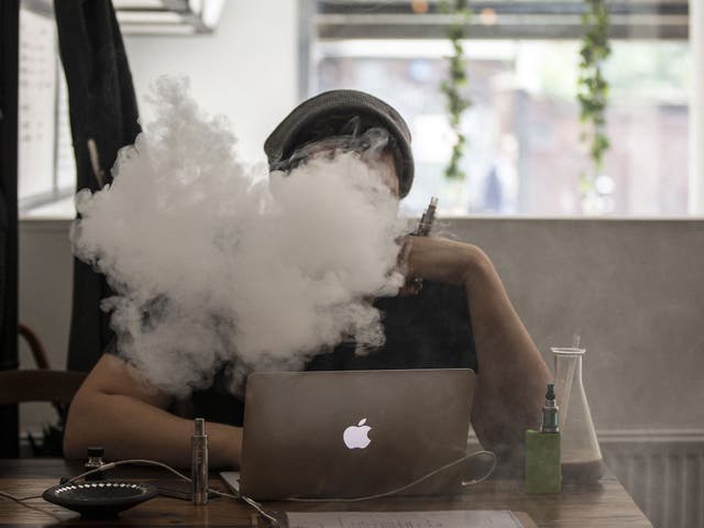 A man smokes an E-Cigarette in the Vape Lab coffee bar