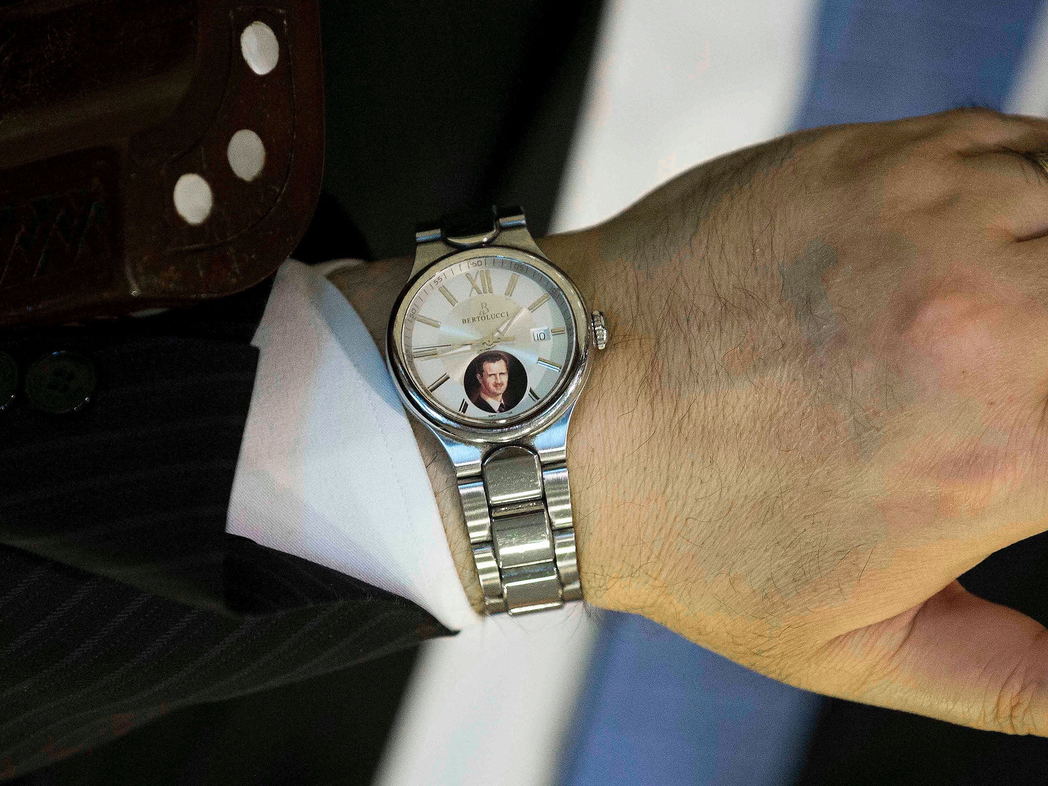 Syrian minister Faisal Mekdad's watch, featuring a picture of his President, Bashar al-Assad
