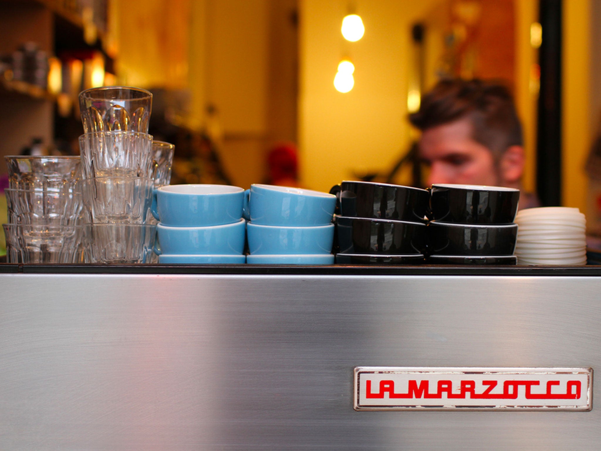 A barista at work at Papercup in Glasgow