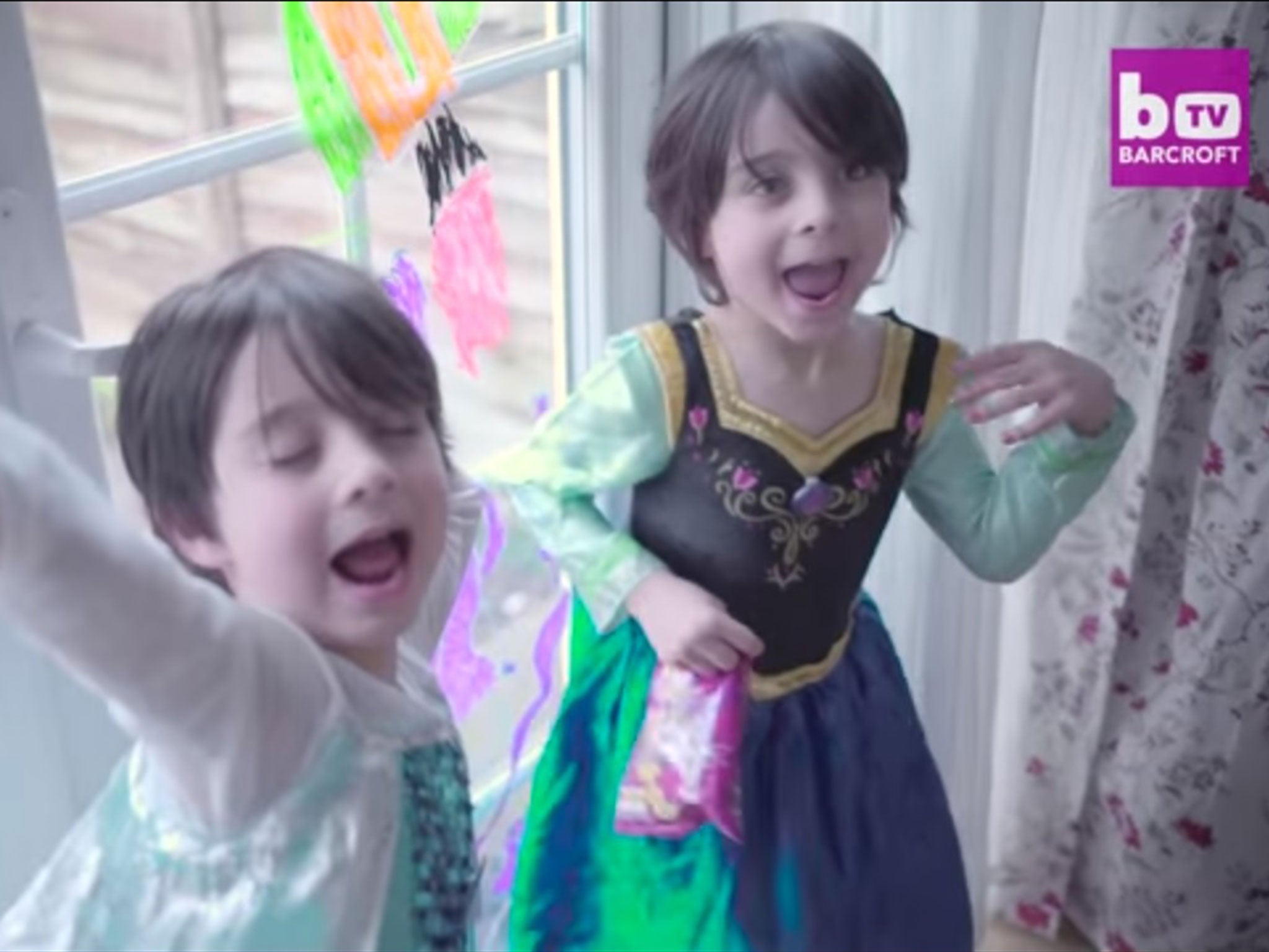 The twins dance around their family home in princess outfits
