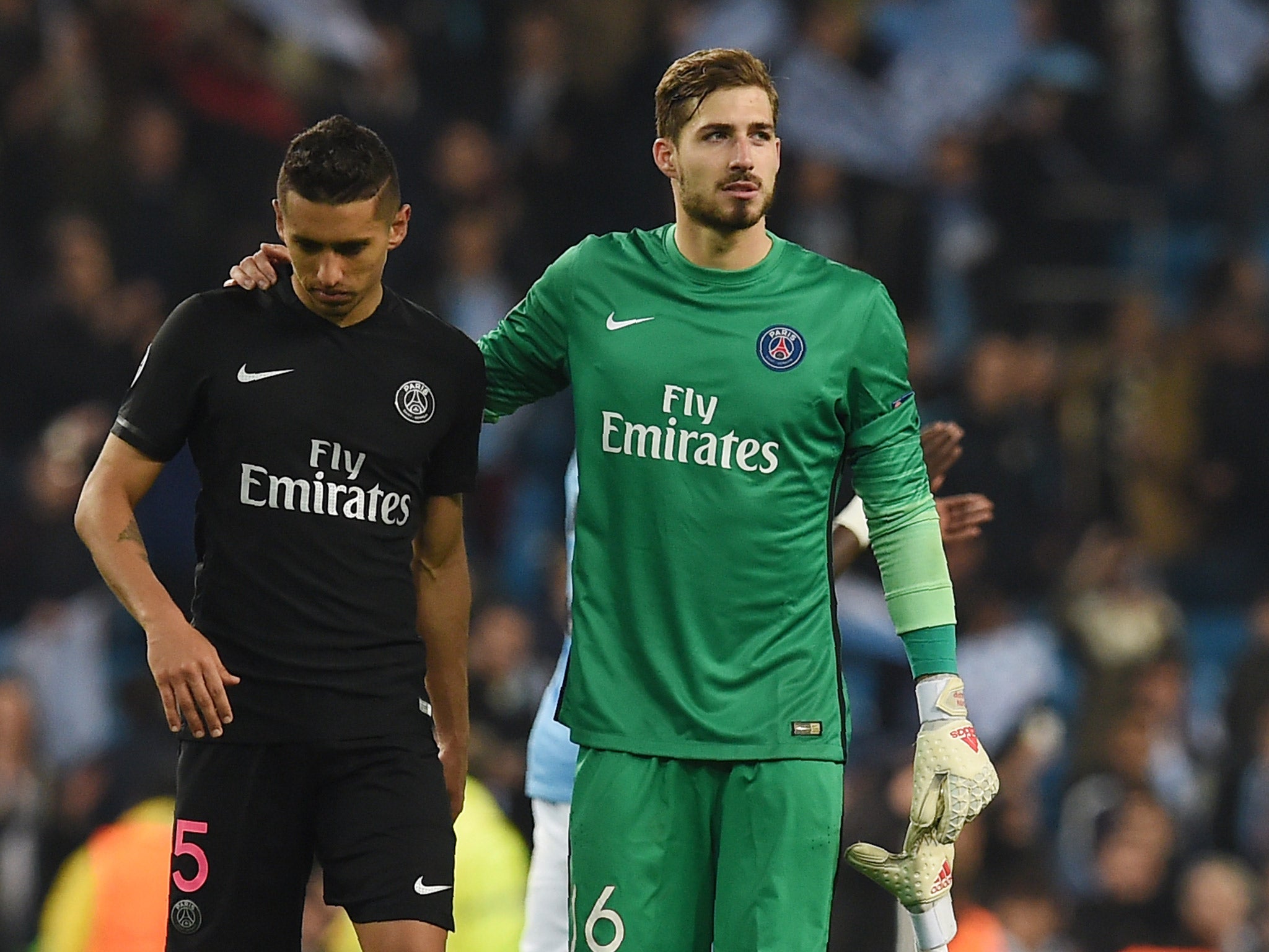 Marquinhos is consoled by Kevin Trapp after PSG's Champions League exit