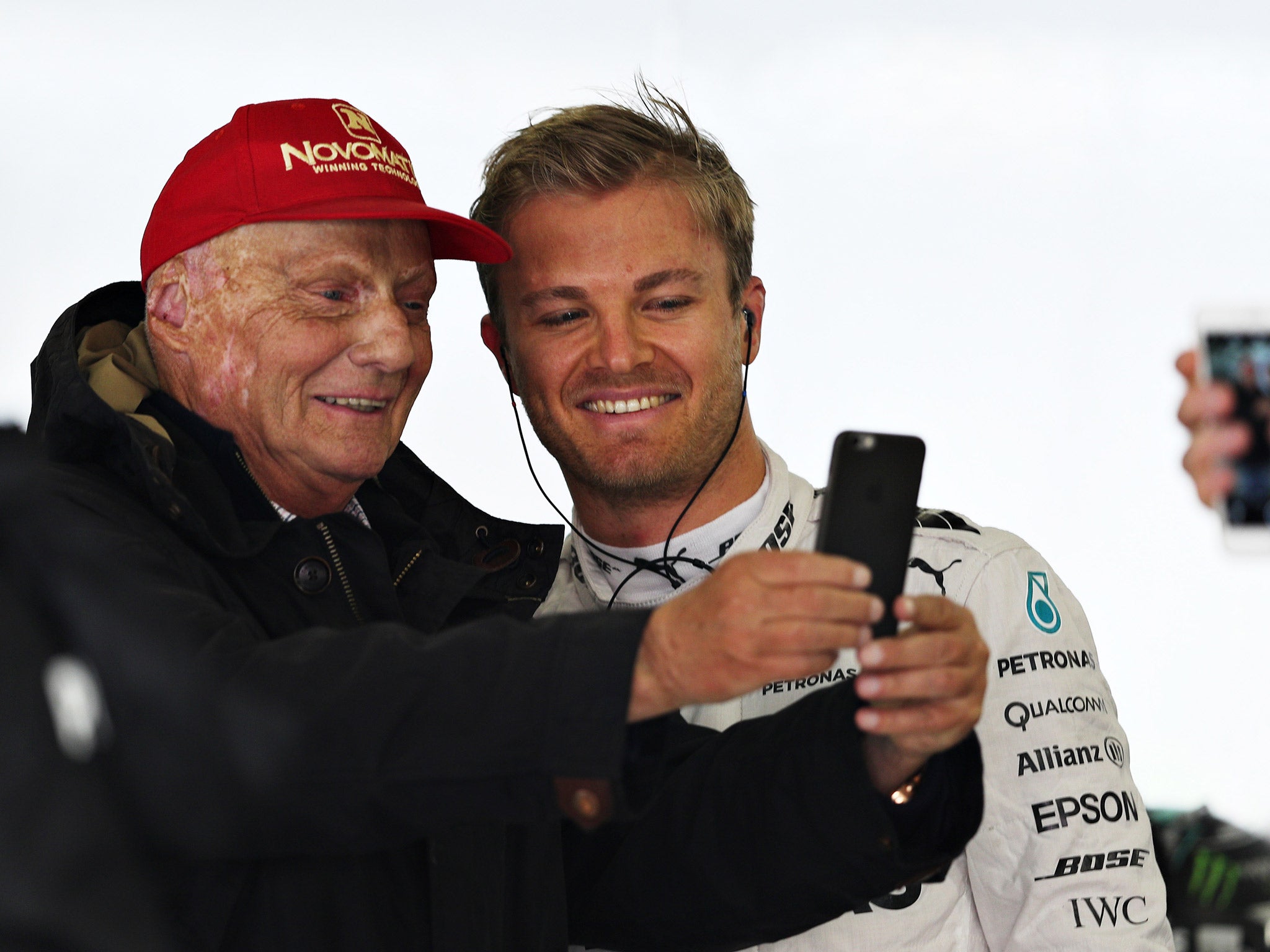 Niki Lauda takes a selfie with Nico Rosberg