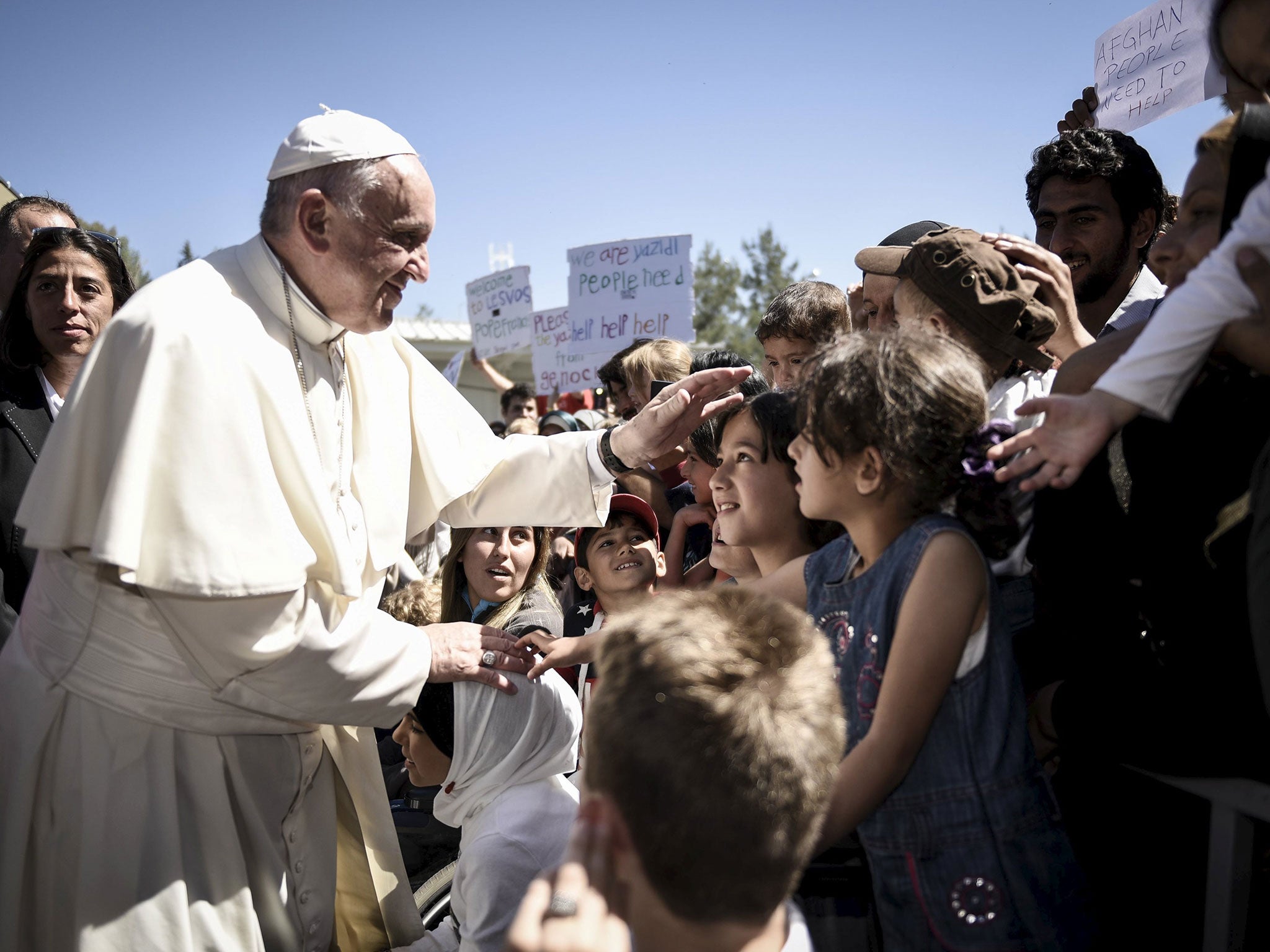 Pope Francis greets migrants and refugees at Moria detention centre on the Greek island of Lesbos, 16 April 2016