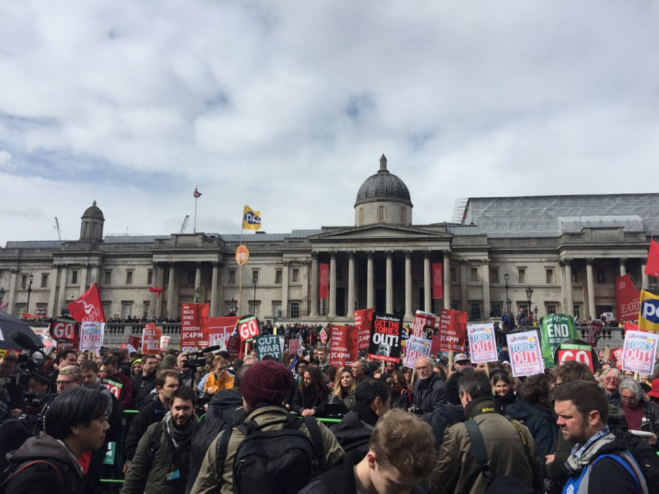 Anti-austerity protesters in Trafalgar Square, London, call for David Cameron to resign