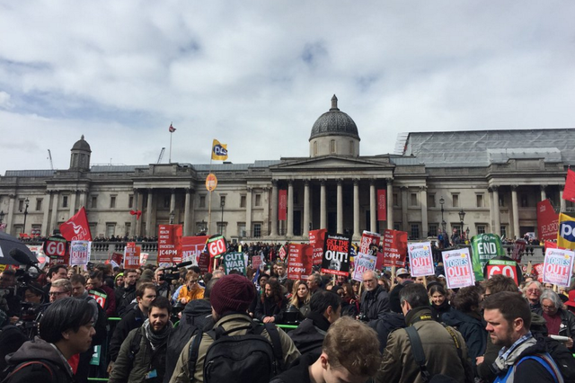 Anti-austerity protesters in Trafalgar Square, London, call for David Cameron to resign