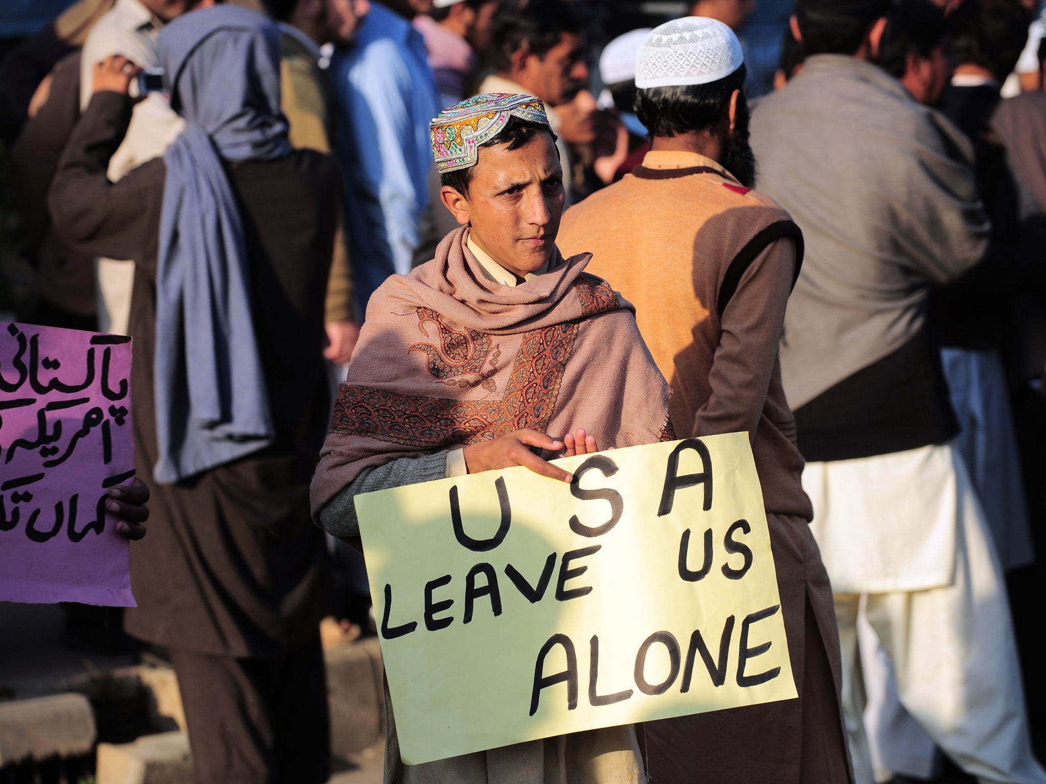 A Pakistani boy during a protest against US drone attacks on North Waziristan in Islamabad on December 10, 2010