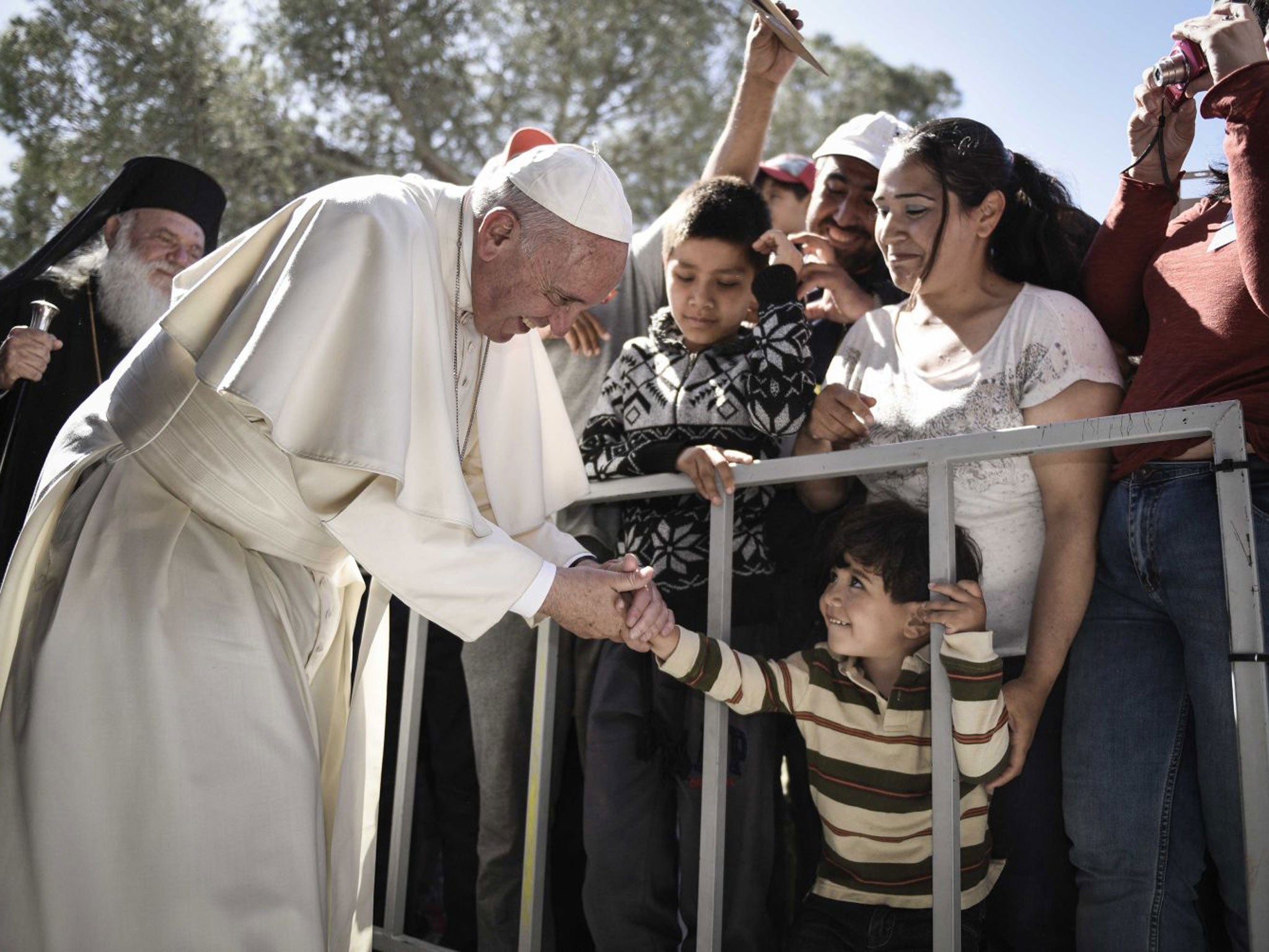 Pope Francis greets migrants at the Moria detention centre in Mytilene, Lesbos