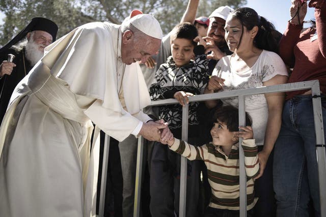 Pope Francis greets migrants at the Moria detention centre in Mytilene, Lesbos