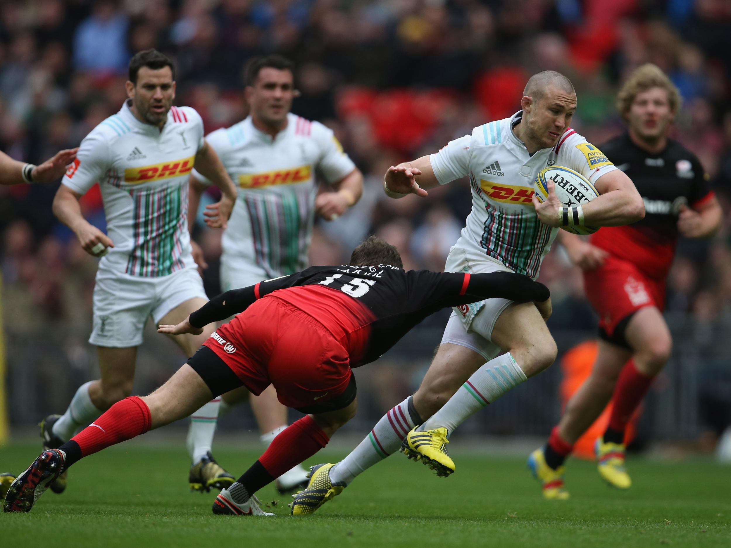 Mike Brown is tackled by Alex Goode