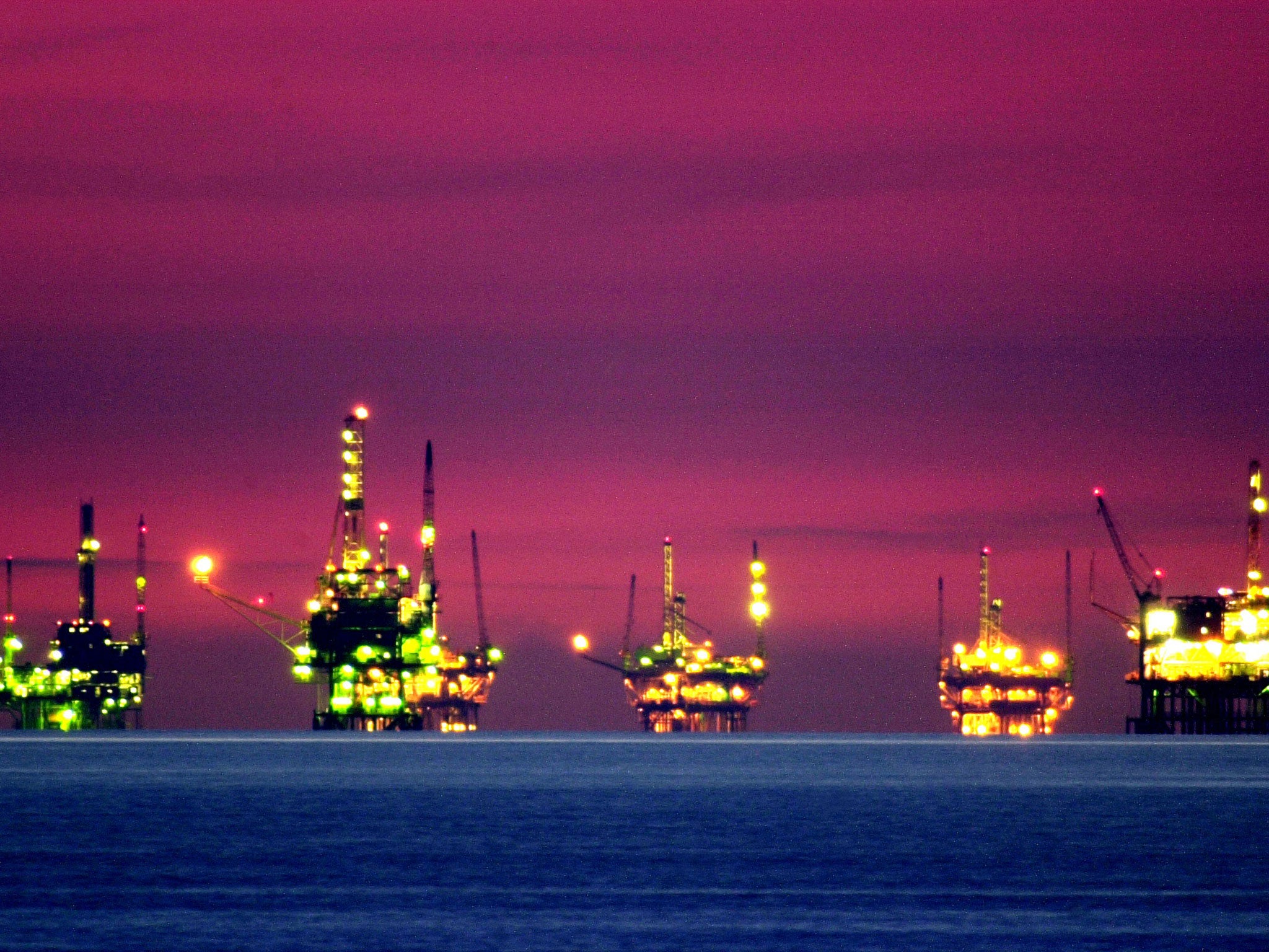 Drilling platforms sit offshore near California. The World Bank expects oil prices to average $41 per barrel this year, down from a projected $51 per barrel in January