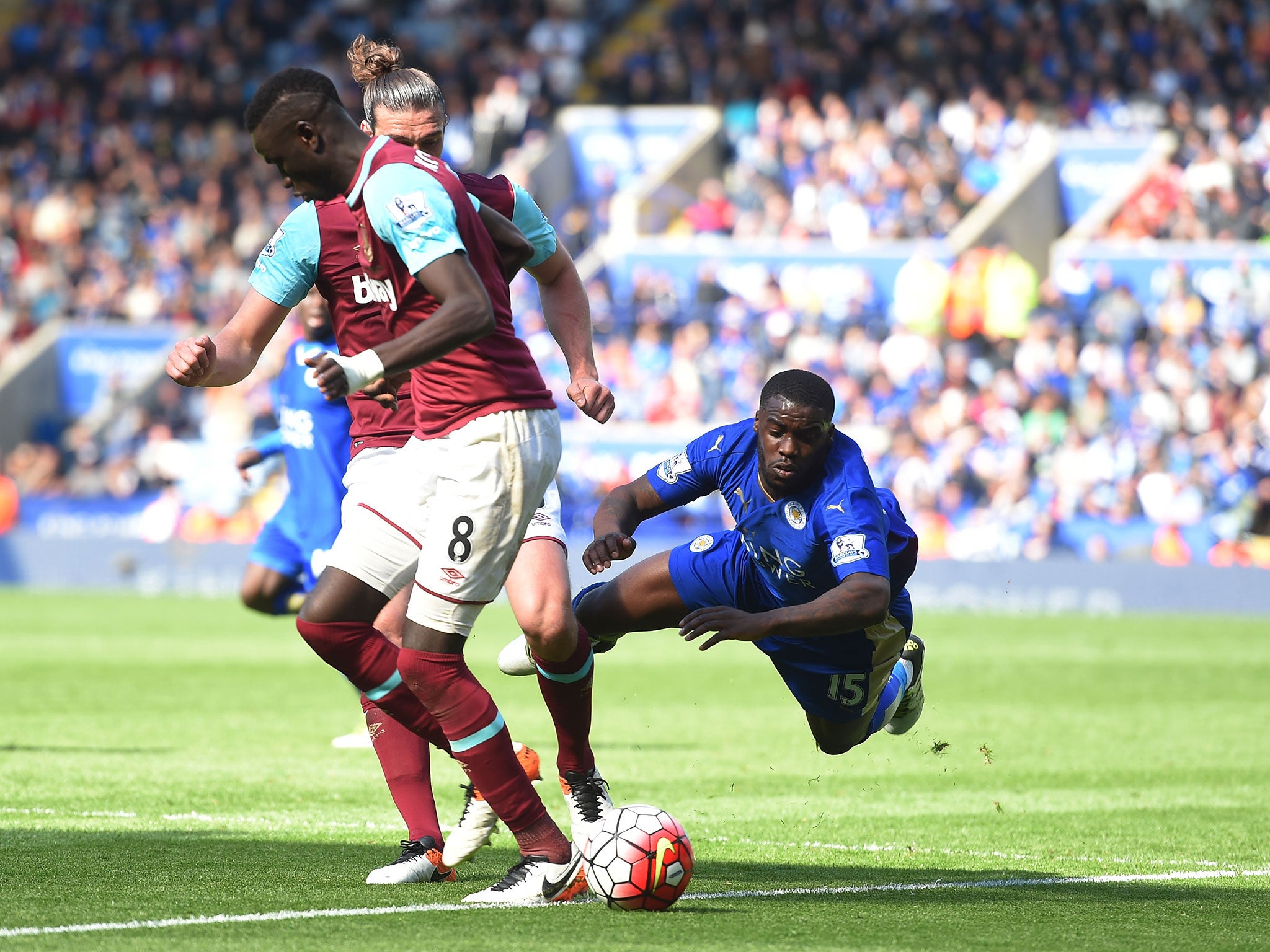 Jeff Schlupp goes down under the challenge of Andy Carroll to win Leicester a penalty