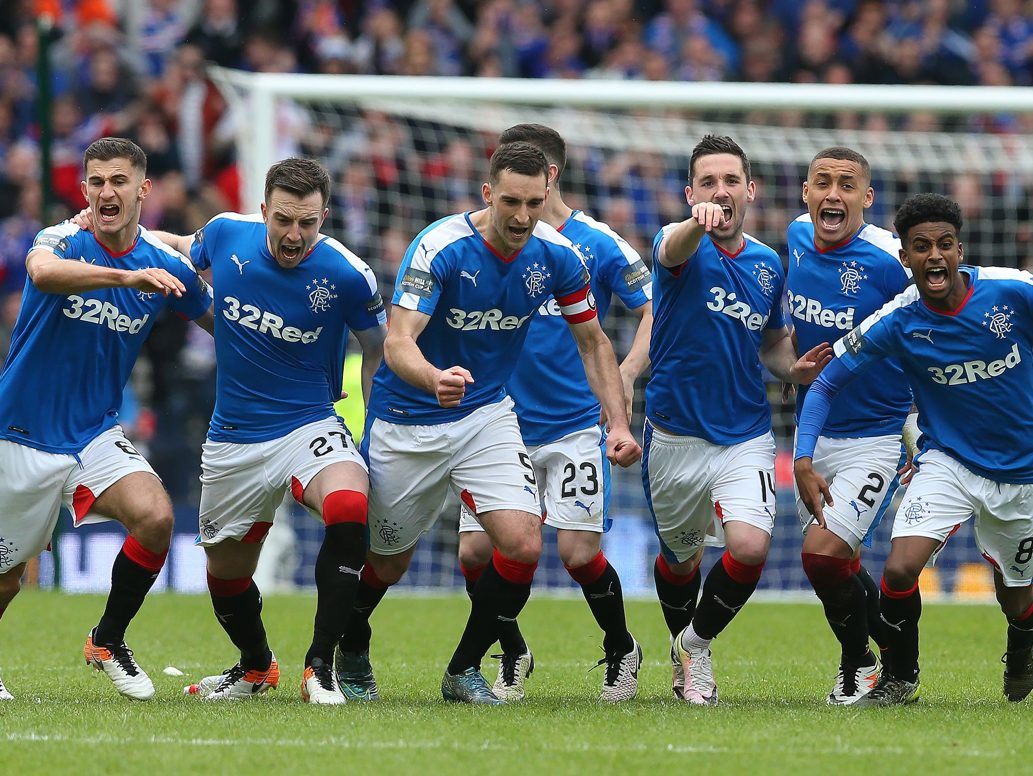 Rangers players celebrate after winning on penalties