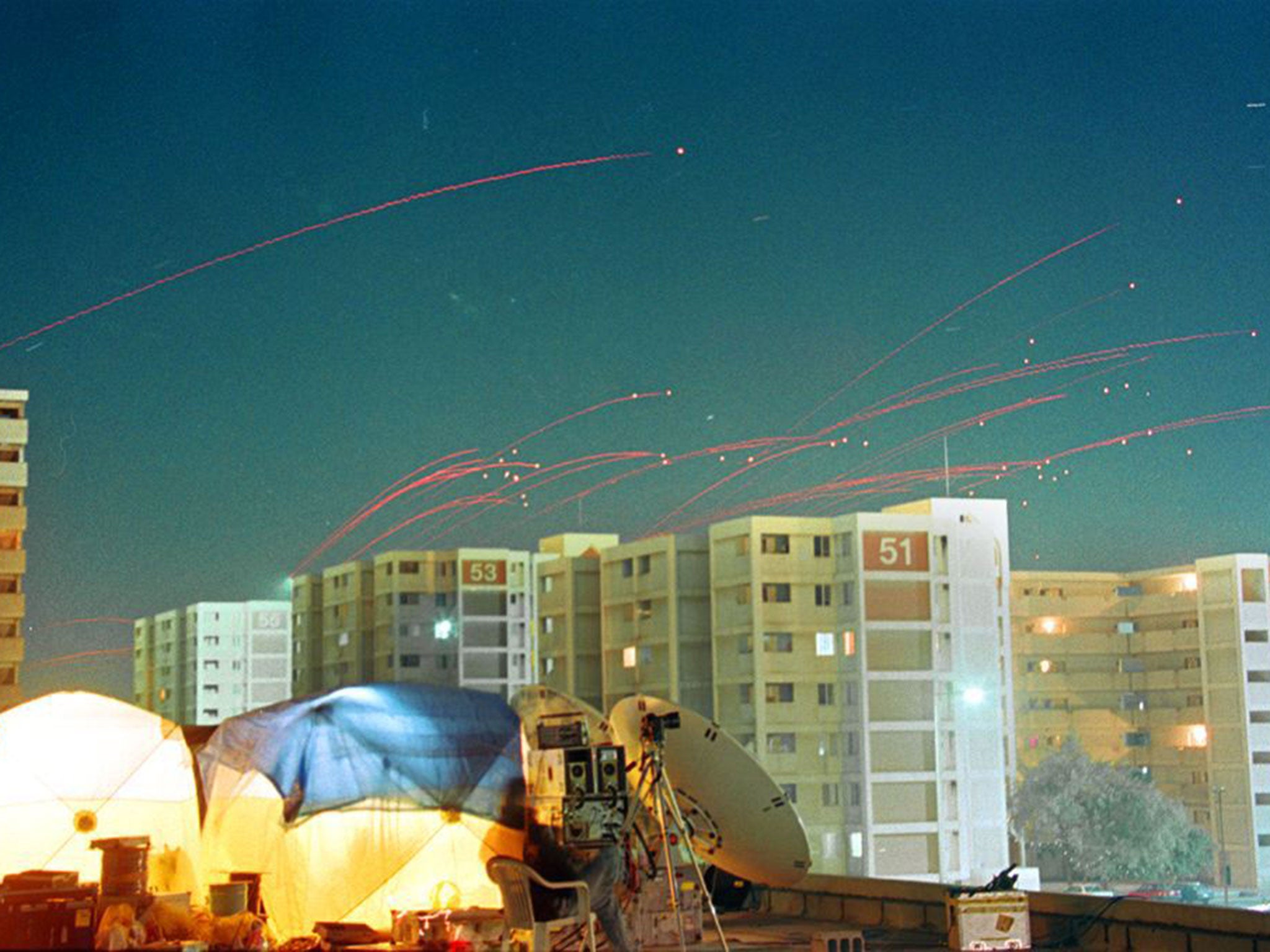 Red traces of anti-aircraft machine gun fire sear across the Baghdad skyline. Several missiles crashed into Baghdad almost immediately after air raid sirens sounded, as then British Prime Minster Tony Blair pledged that US-led air strikes on Iraq would continue until they had achieved their military objectives